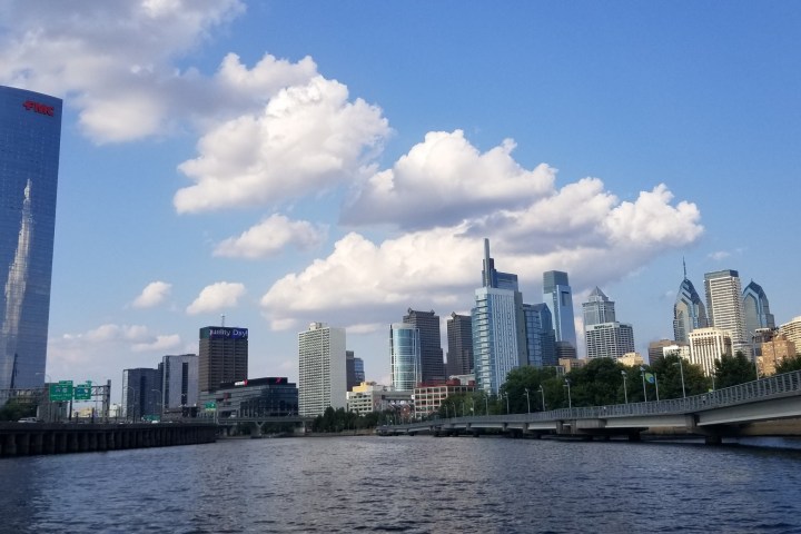 a large body of water with a city in the background