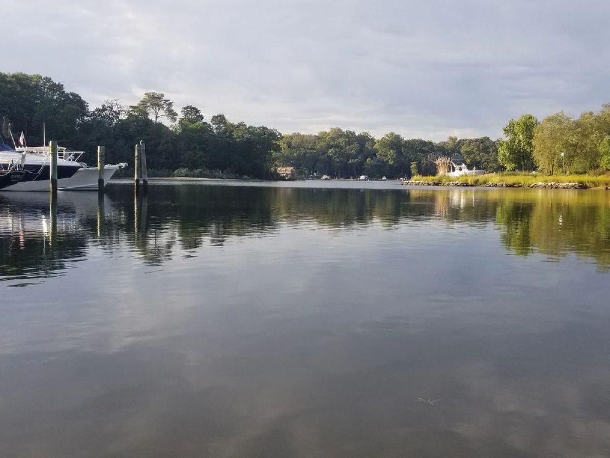 a boat is docked next to a body of water